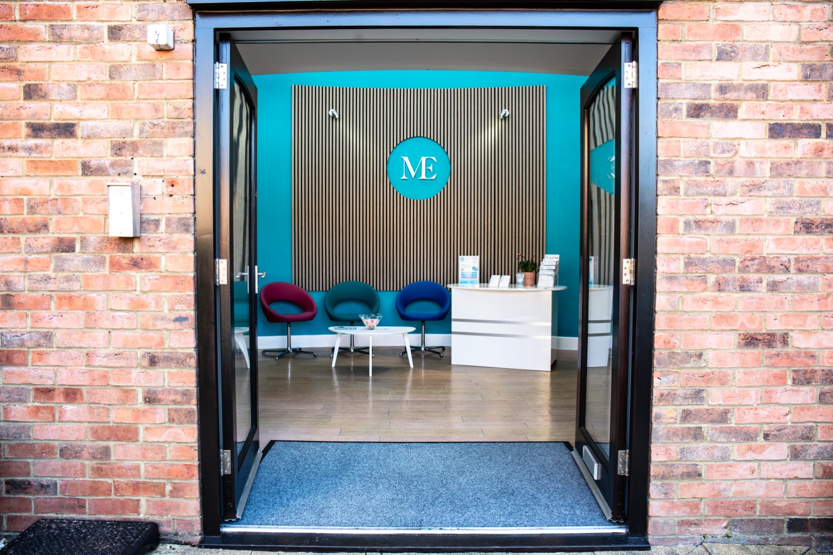 Blue, grey white logo.